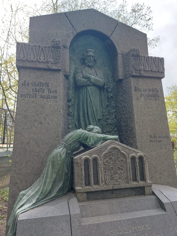 Visitor documents Russian artists' graves at Saint Petersburg cemetery