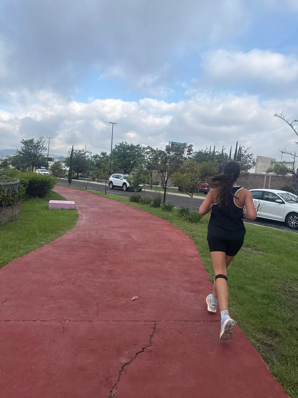 Running on a red path through a Puebla-area park