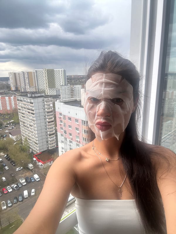 Woman takes selfie wearing face mask in Moscow