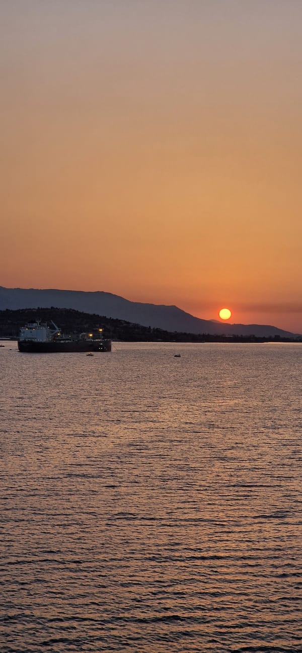 Golden sunset over the Greek coastline at Agioi Theodoroi
