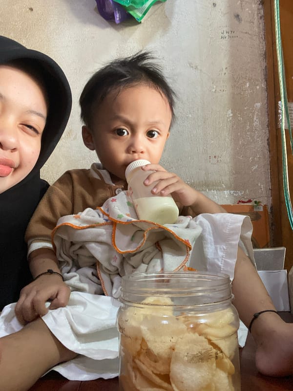 Toddler's day unfolds amid local markets and street life in Ta', Indonesia