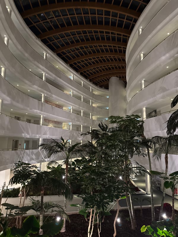 Indoor atrium garden and pool area documented in building