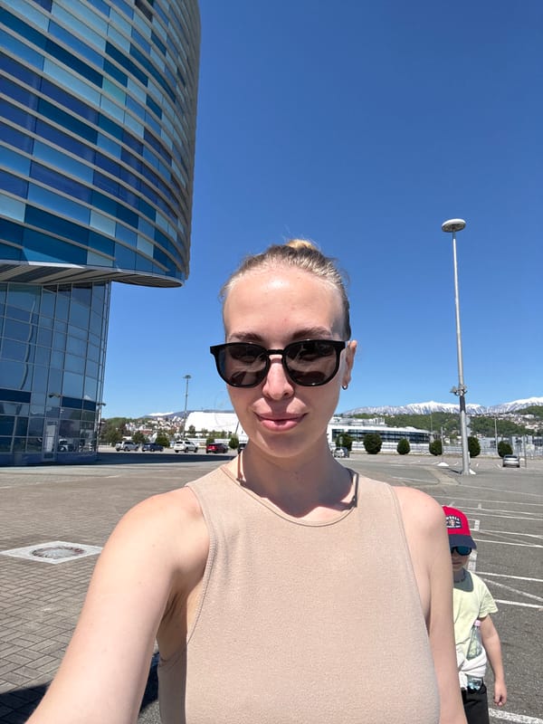 Woman documents sunny day at Sochi Autodrom racetrack