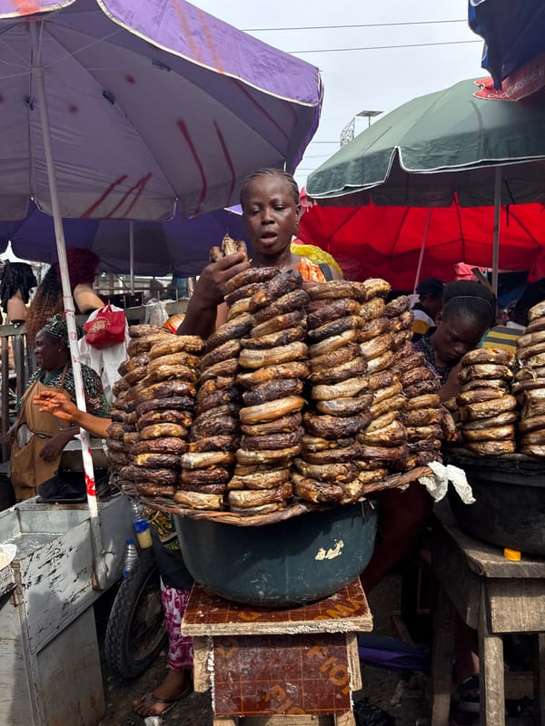 Fish vendor photographed at bustling Lekki market
