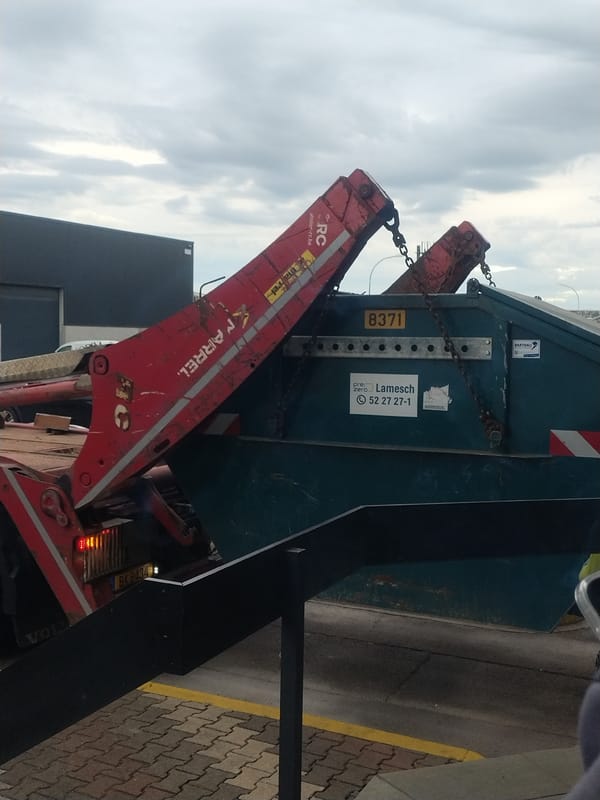 Industrial truck operations documented in rainy Luxembourg morning