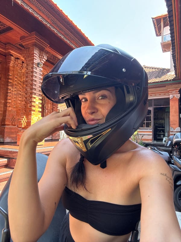 Helmet selfies and a parked scooter in North Kuta, Bali