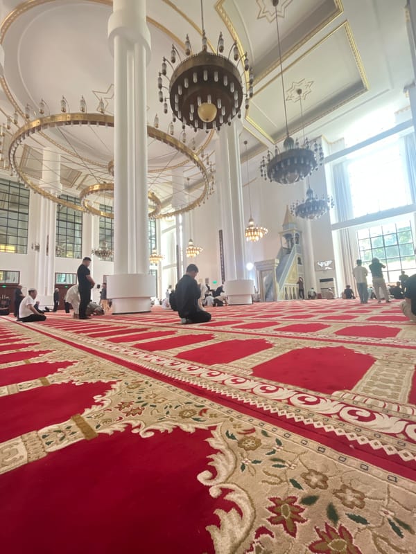 Men perform morning prayers at Jiulongpo District mosque