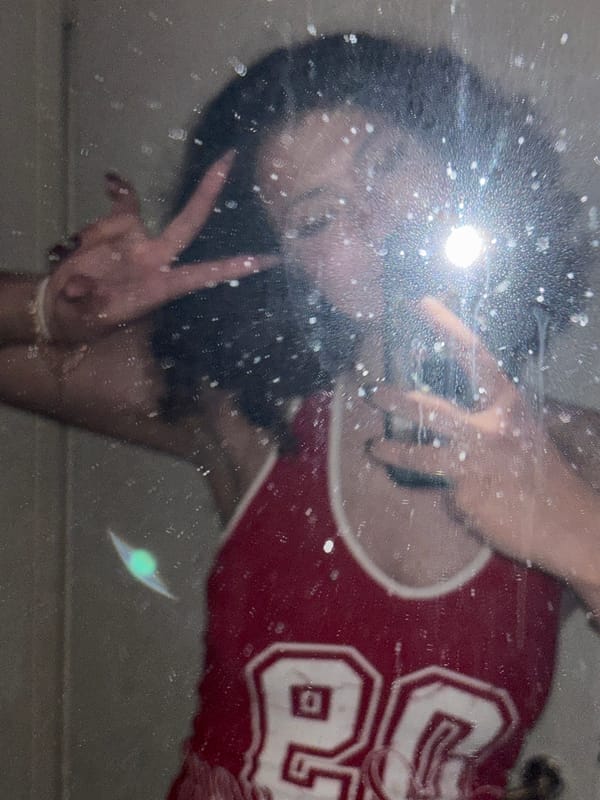 Mirror selfie captured in Milan featuring red jersey number 80