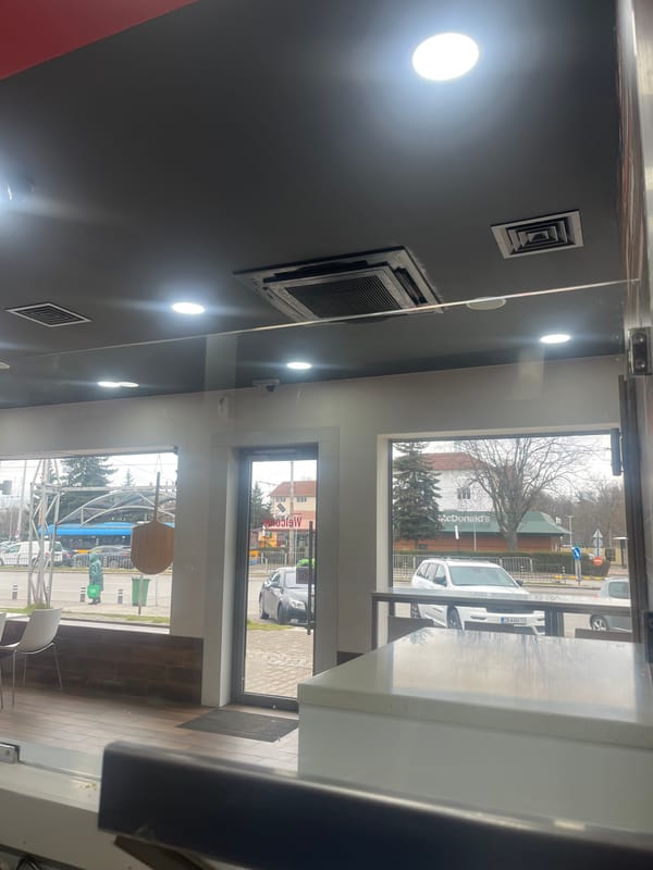 Interior business view overlooks Sofia cityscape with McDonald's visible