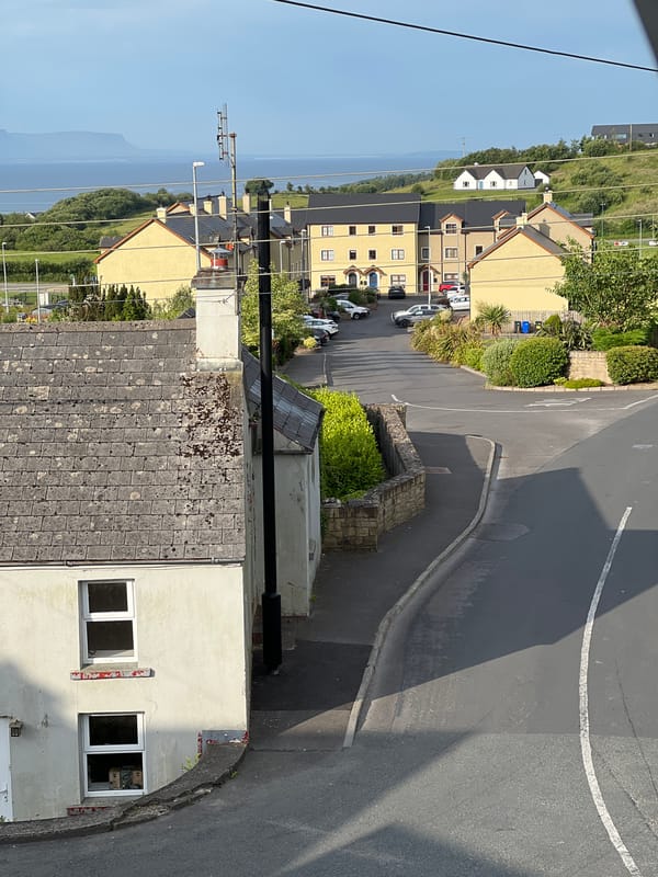 Cash, fruit, and coastal rooftops on a Donegal morning