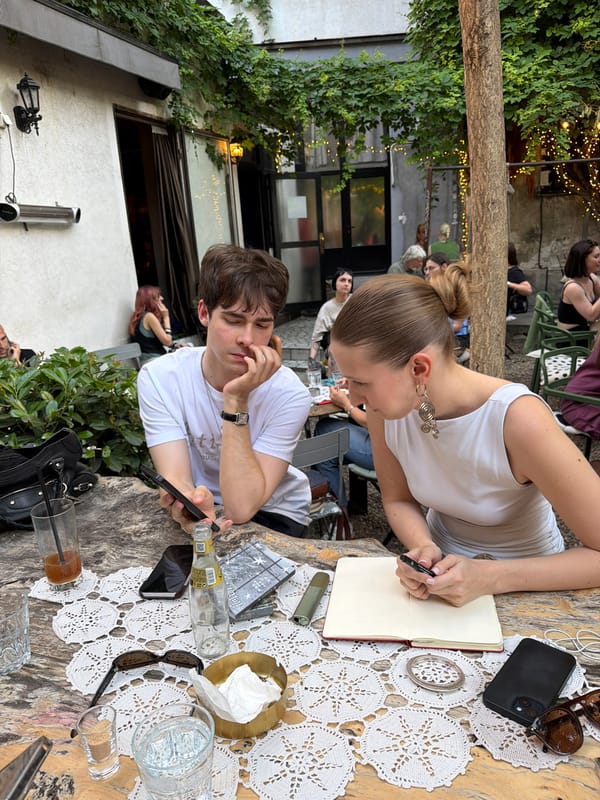 Afternoon cafe socializing captured in Belgrade courtyard garden