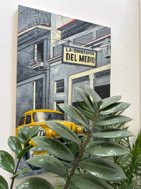 Street scene painting with Cuban restaurant sign observed in Montenegro