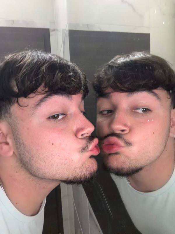 Bathroom mirror moment and kiss hashtag captured in Rijeka