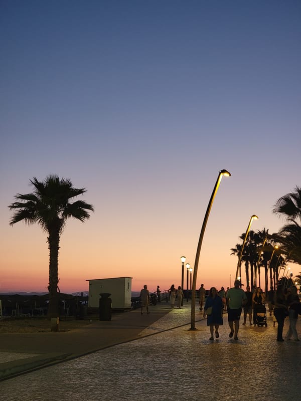 Quarteira beachfront at golden hour into night