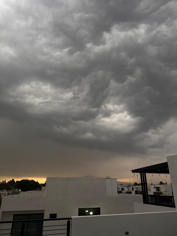 Storm clouds create dramatic lighting over Cholula, Mexico