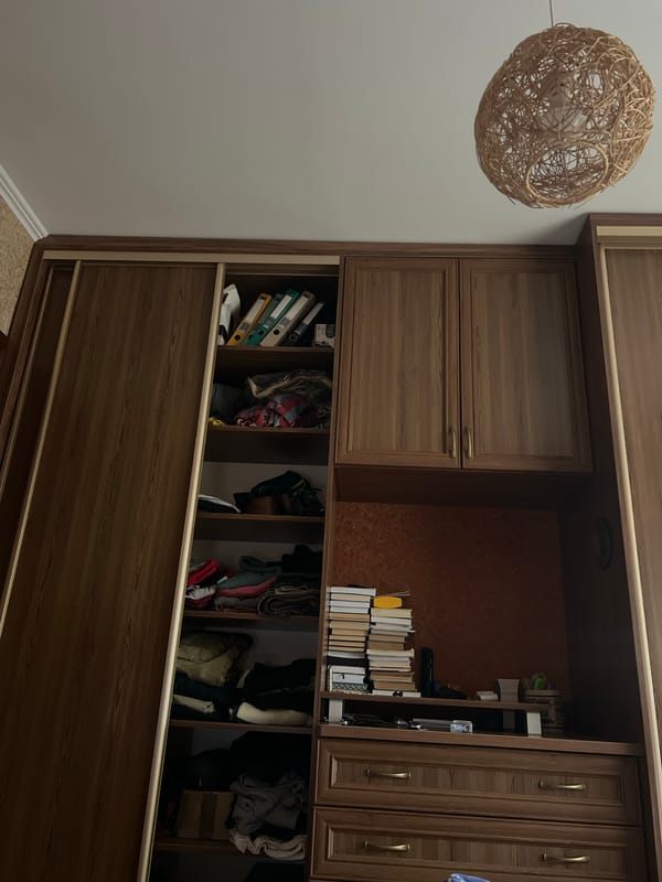 Wardrobe interior and vintage product label, June 2026