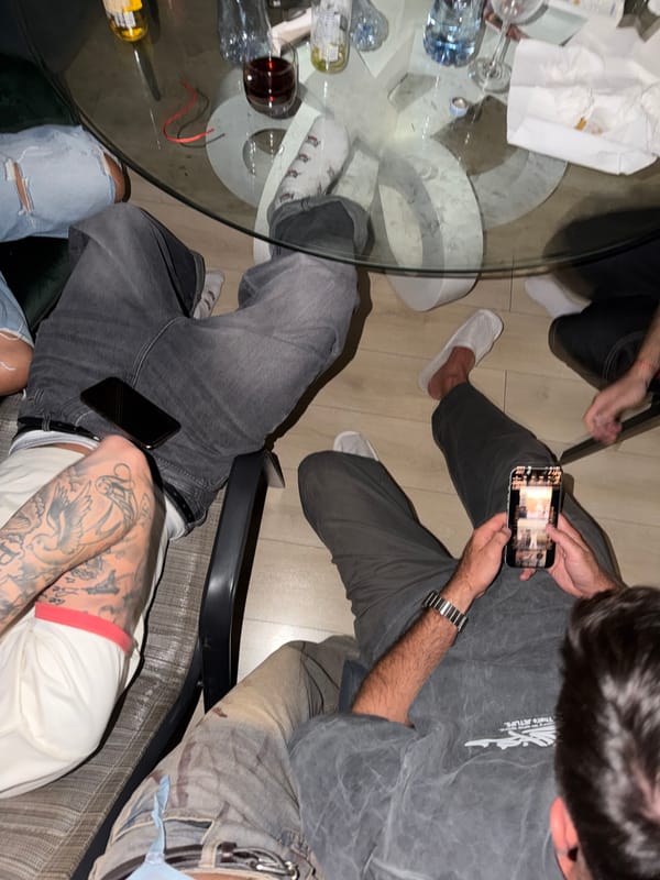 Casual gathering around a glass table in Tbilisi