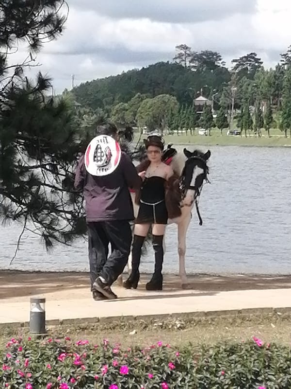 Lakeside horse rides and tourist scenes at Xuan Huong Lake, Da Lat