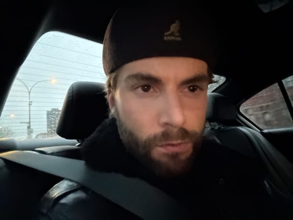 Man with cake box photographed in Montreal vehicle