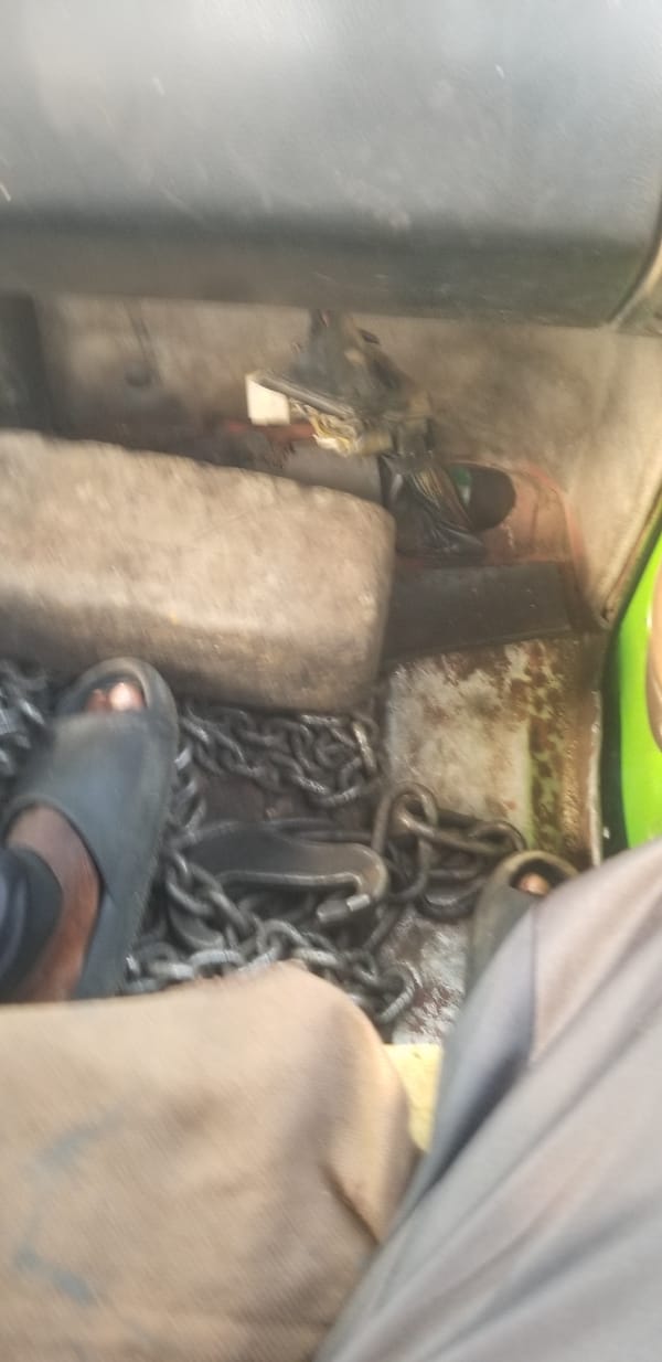 Vehicle storage area documented with chains in Nigeria