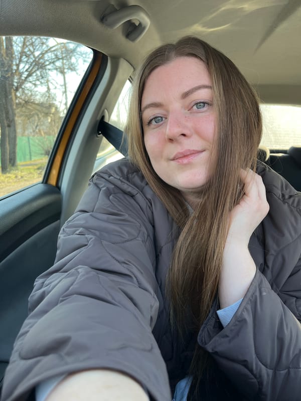 Woman takes selfie in car in Maksimkovo, Russia