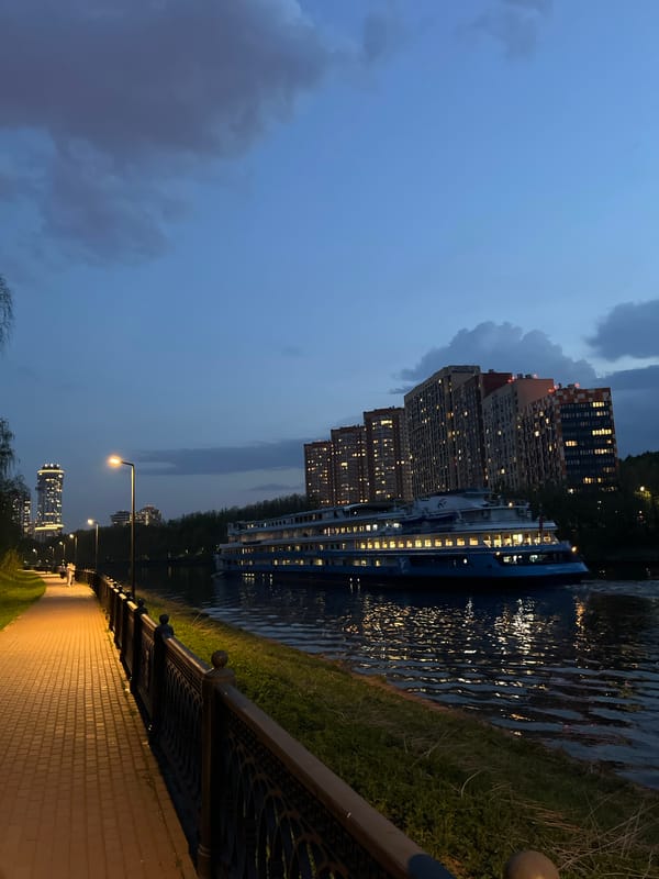 Evening stroll captured along Khimki waterfront walkway