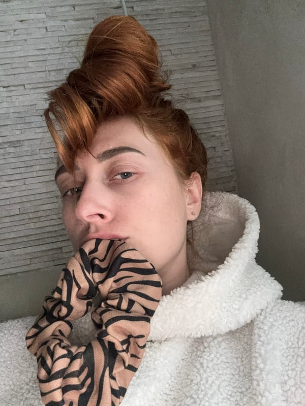 Woman documents casual indoor moments with hair styling in Budva