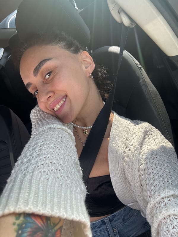 Car selfie session in Tbilisi, white cardigan and pearl necklace