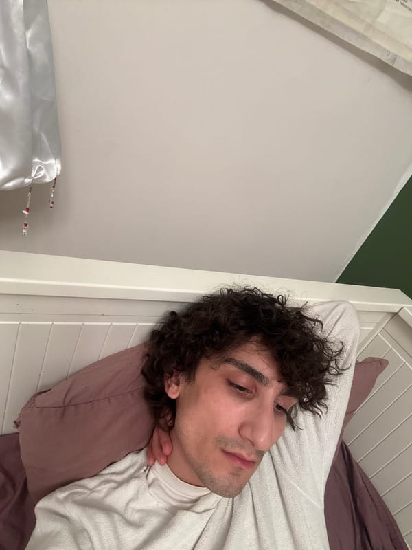 Young man resting in Moscow bedroom late evening