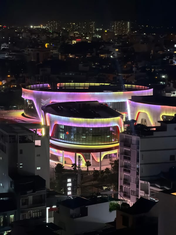 Nighttime aerial documentation of illuminated Nha Trang cityscape captured