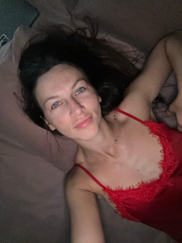 Personal photo session in a Montenegro room, red lace outfit