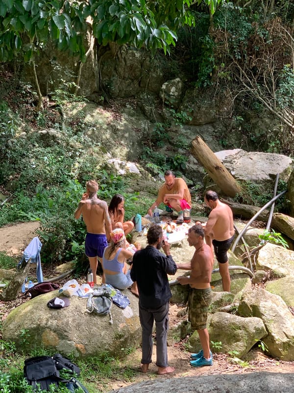 Tourists explore jungle waterfall swimming spot in Ko Samui
