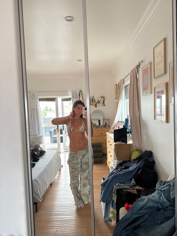 Mirror selfie in a laid-back LA bedroom on the Fourth