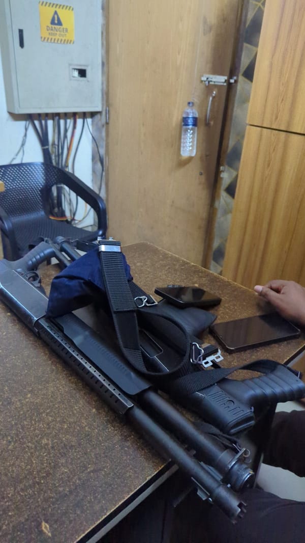 Table with shotgun and equipment observed in Dhaka