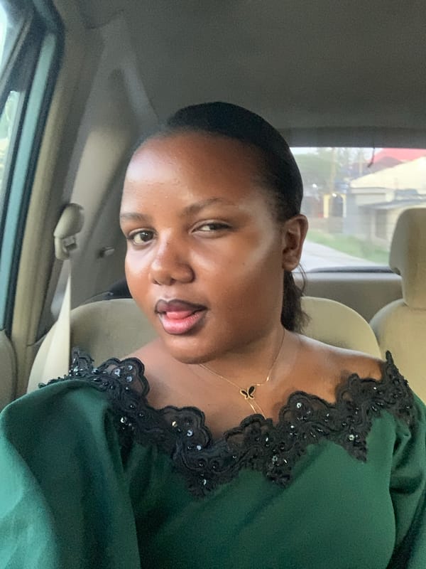 Woman in green dress photographed in early morning Dar es Salaam