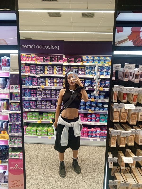 Shoppers take selfies in cosmetics mirrors at Pampatar store