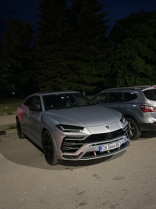 Gray Lamborghini, Nissan parked on Veliko Tarnovo street