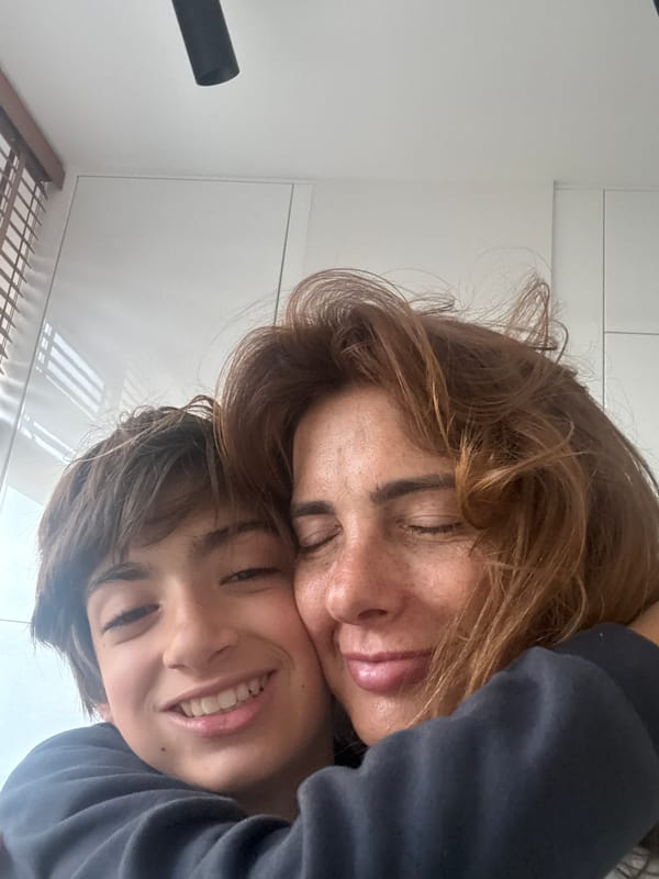 Mother and child share intimate moment in Portugal