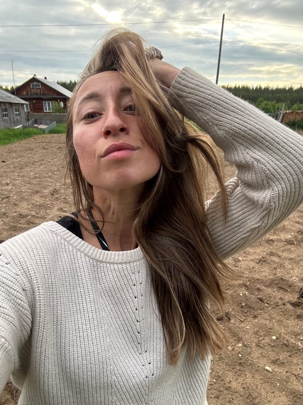Woman documents outdoor fire gathering in rural Russia