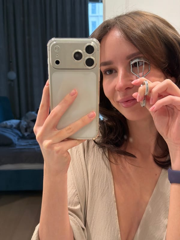 Woman Takes Selfie While Using Eyelash Curler in Moscow