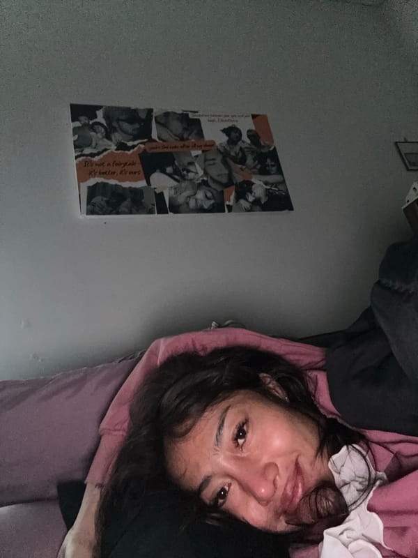 Person resting with electronic device during early morning hours