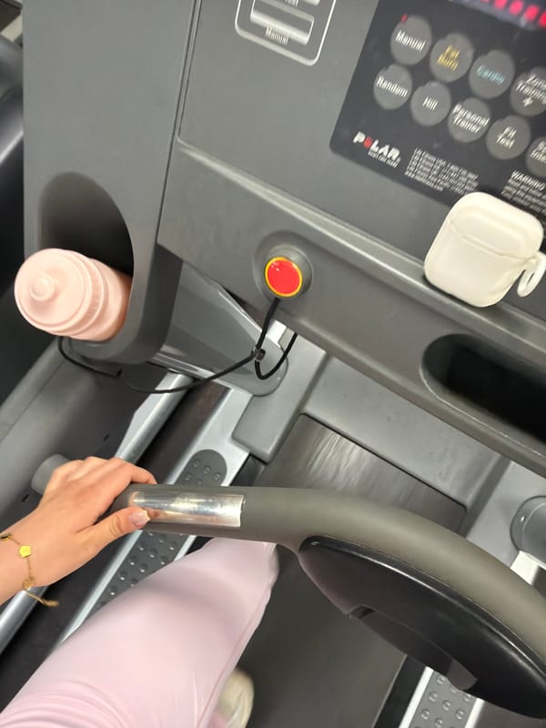 Gym-goer documents treadmill workout with smartphone in Sofia