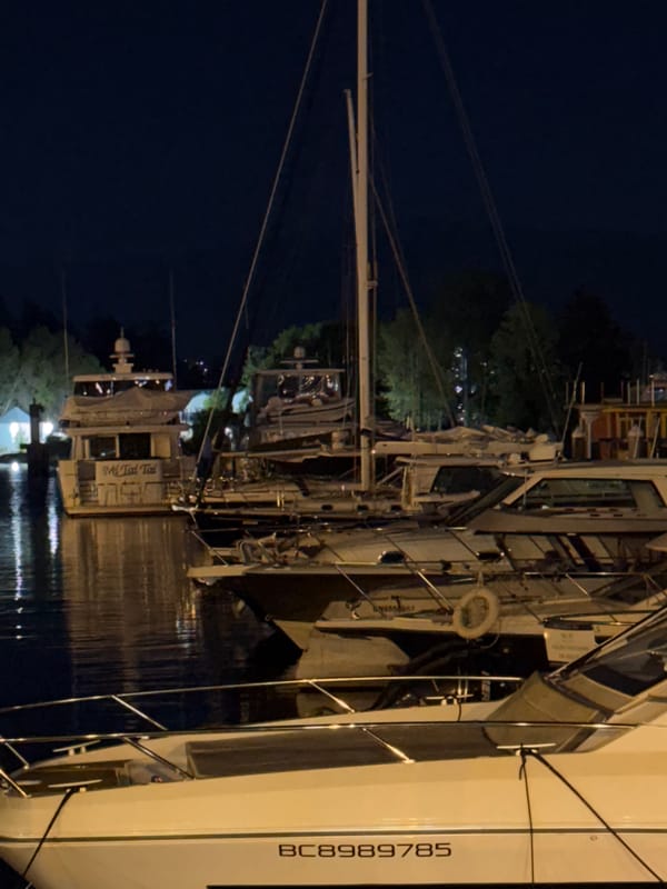 Vancouver marina nighttime scenes documented with luxury boats, vehicles