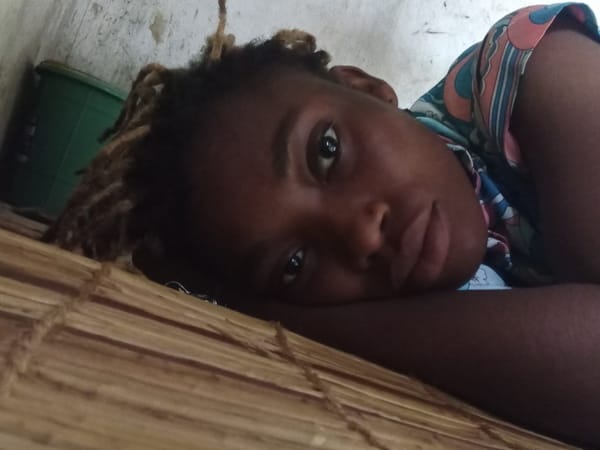 Person with dreadlocks captured in indoor casual moments