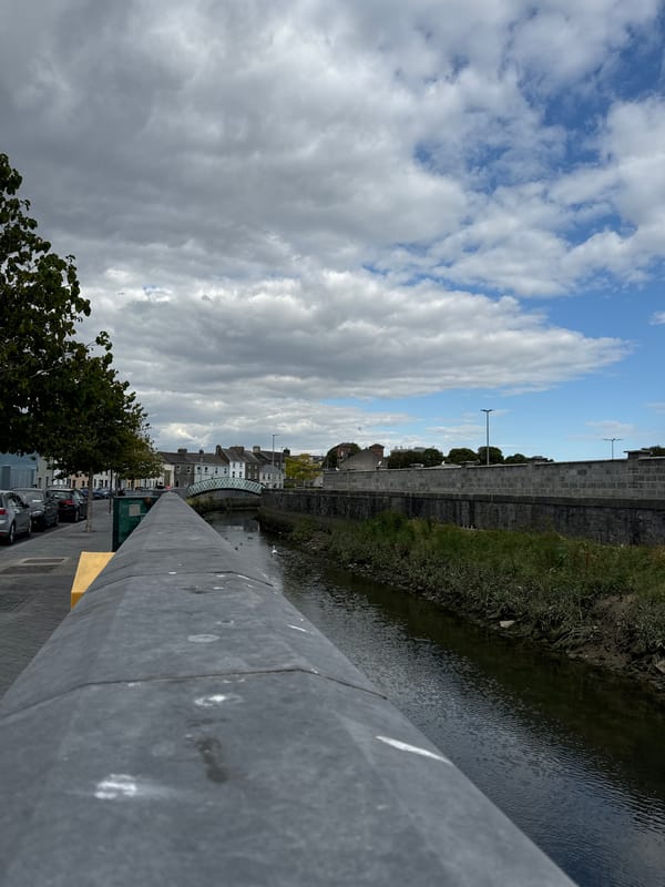Waterford streets, riverbanks, and bare interiors on a cloudy July afternoon