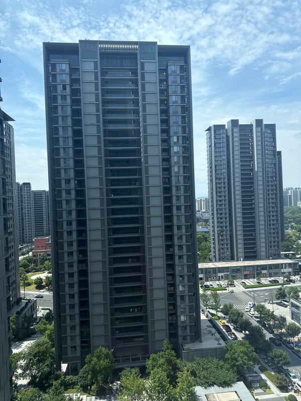 Modern residential towers in Yiwu, seen from street and aerial views