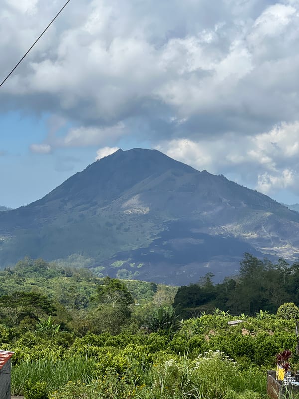 Mountain landscape documented in Kintamani, Indonesia under cloudy skies