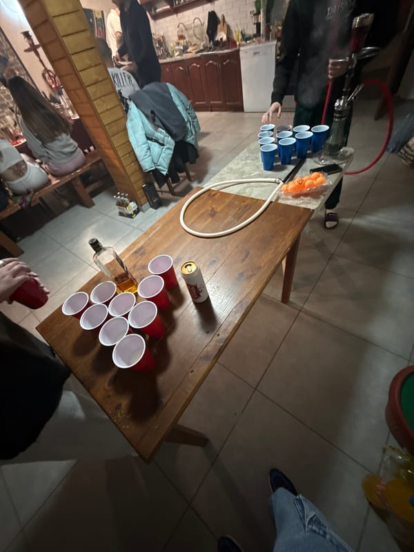 Beer pong game underway in Ribaritsa dining room
