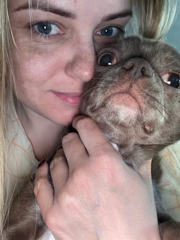 Woman plays with small dogs in Votkinsk apartment