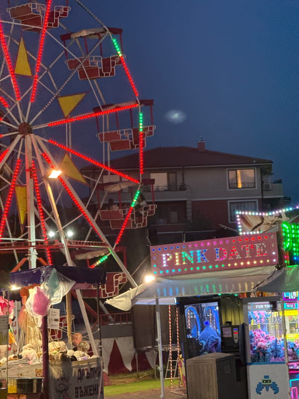 Dinner, drinks, and a Ferris wheel in Ravda at dusk